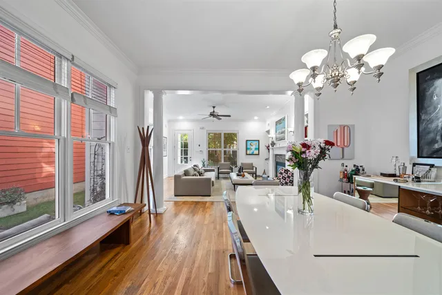 a view of a living room and chandelier