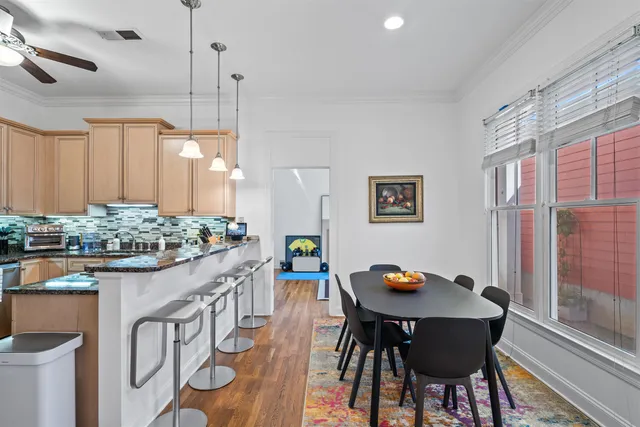 a view of a kitchen with a table and chairs