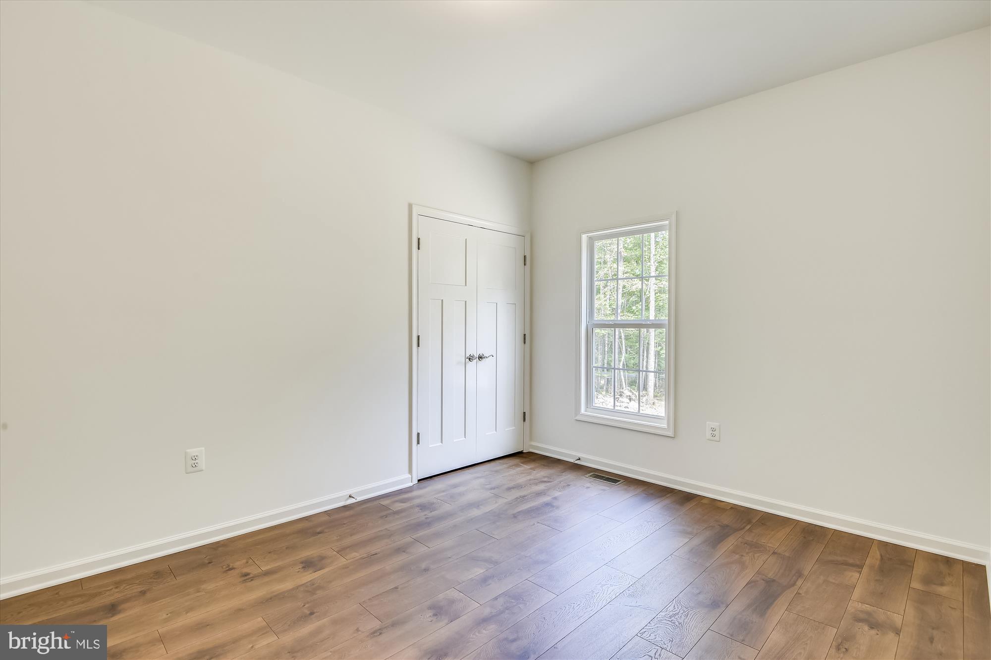 1 Ac Corner Road Sumerduck, VA 22742 - Photo 16 of 31 an empty room with wooden floor and window