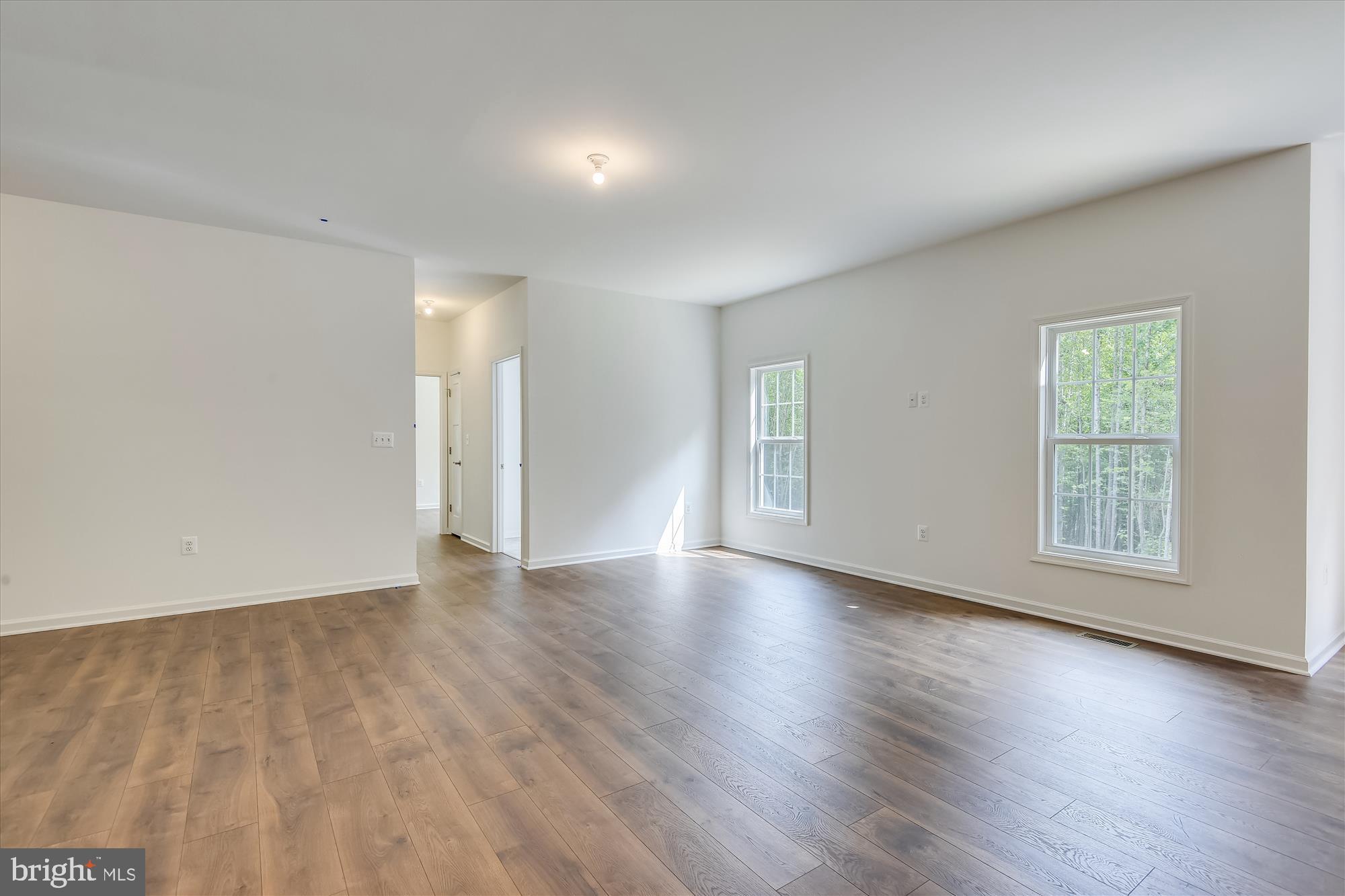 1 Ac Corner Road Sumerduck, VA 22742 - Photo 18 of 31 an empty room with wooden floor and windows