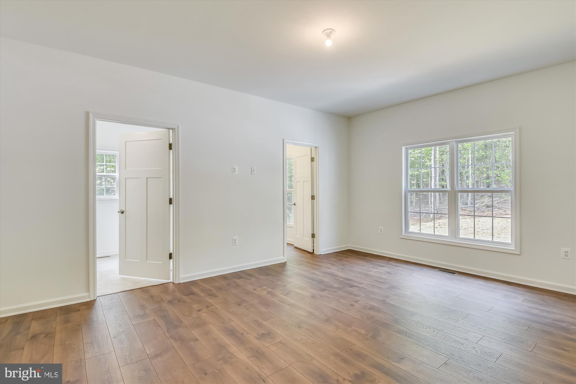 1 Ac Corner Road Sumerduck, VA 22742 - Photo 19 of 31 an empty room with wooden floor and windows
