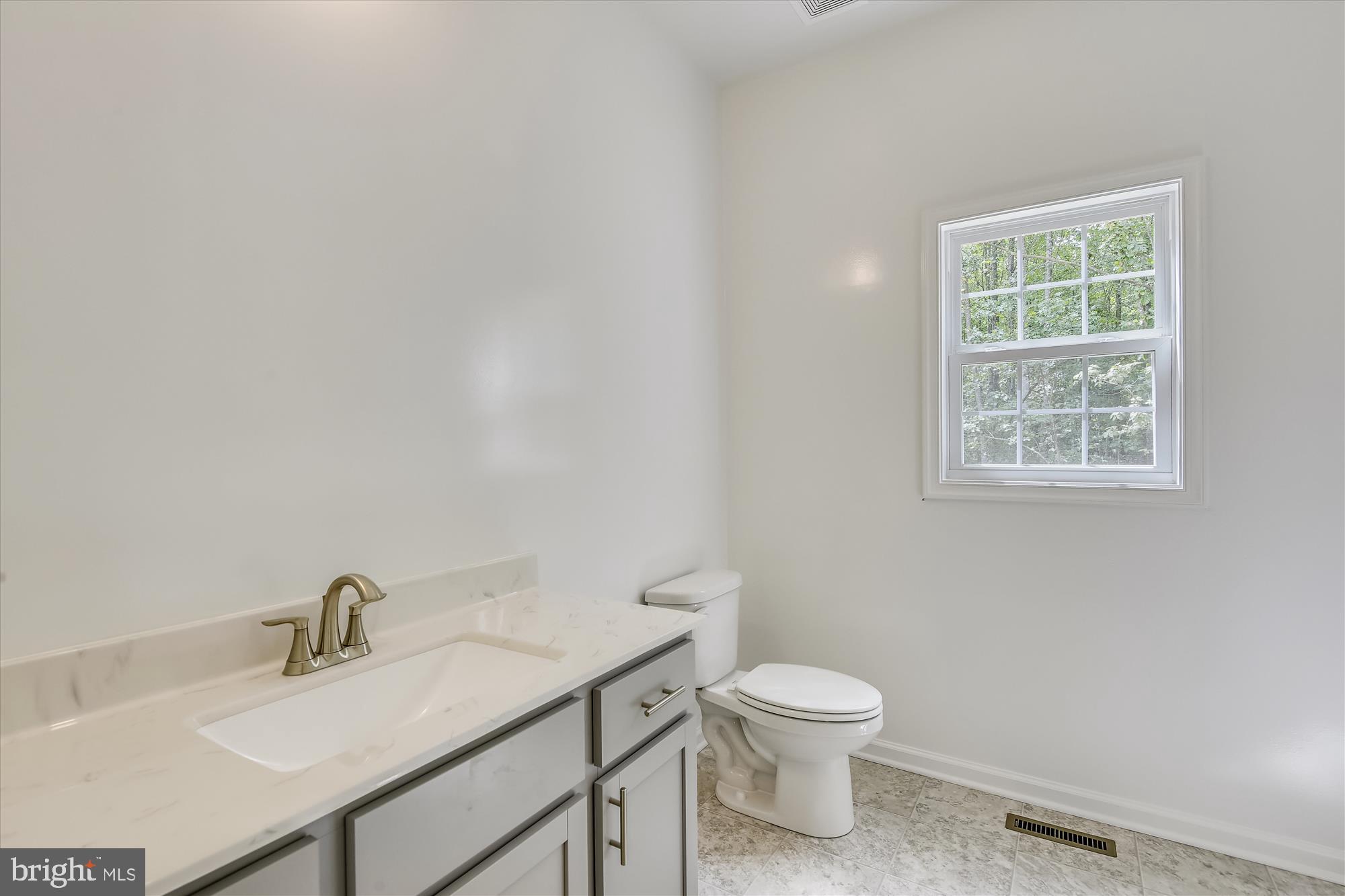 1 Ac Corner Road Sumerduck, VA 22742 - Photo 21 of 31 a bathroom with a toilet a sink and mirror