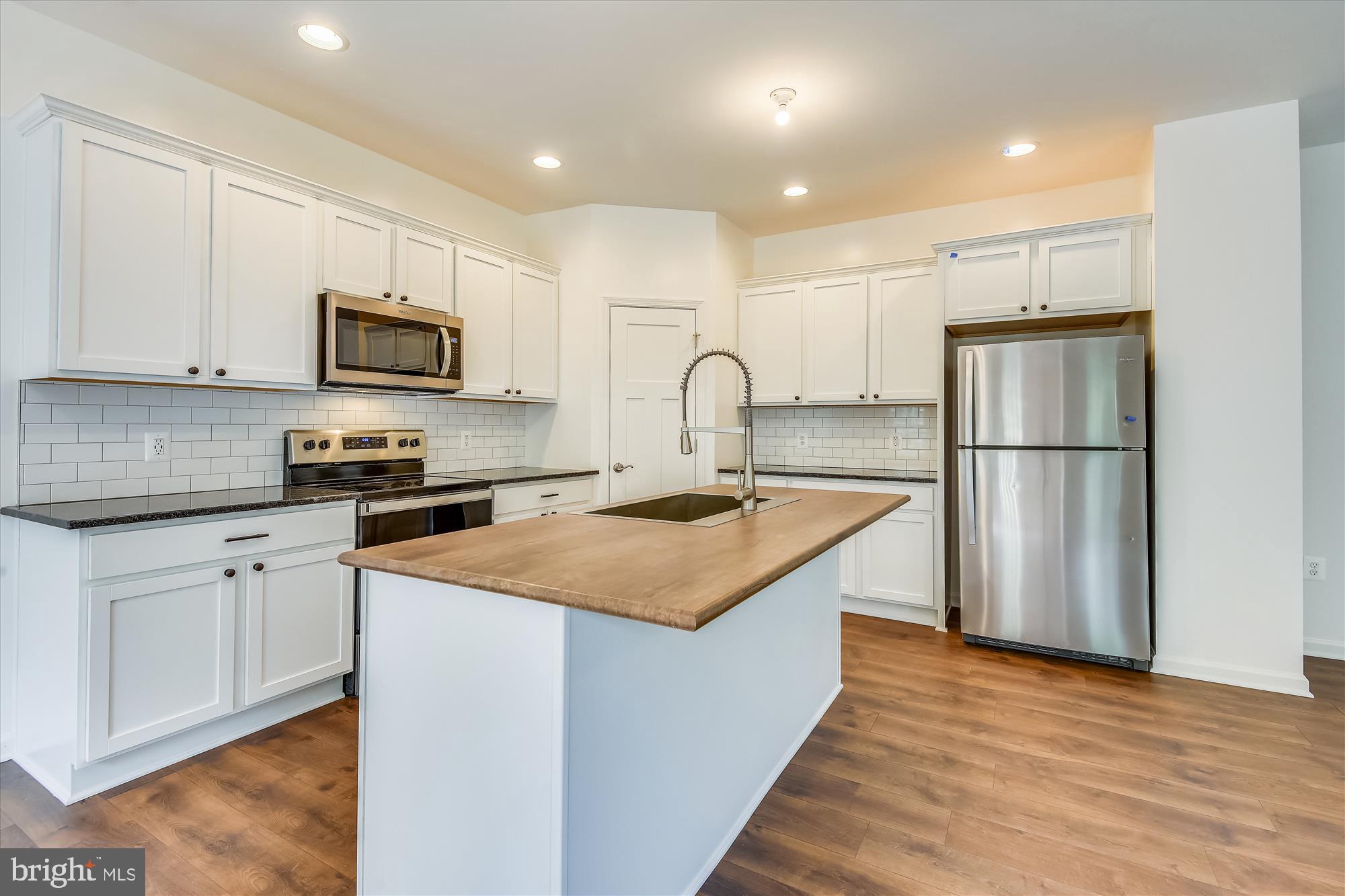 1 Ac Corner Road Sumerduck, VA 22742 - Photo 8 of 31 a kitchen with stainless steel appliances granite countertop a refrigerator a sink a stove a microwave and cabinets