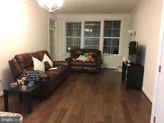 a kitchen with stainless steel appliances granite countertop a sink a stove and a microwave