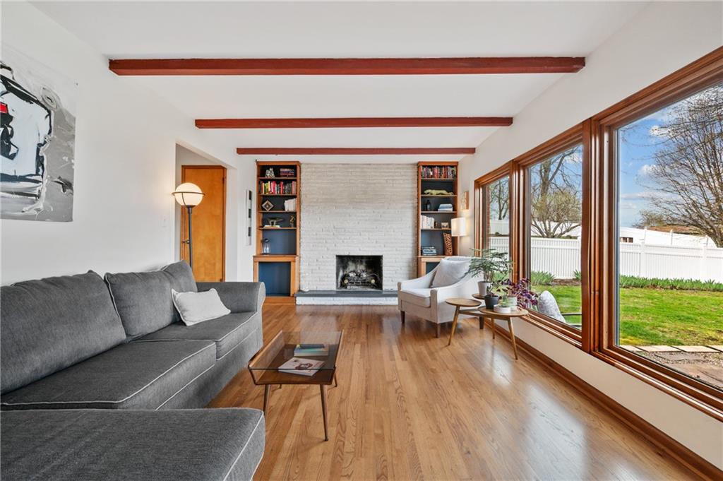 419 Amherst Avenue Coraopolis, PA 15108 - Photo 7 of 29 a living room with furniture and a fireplace