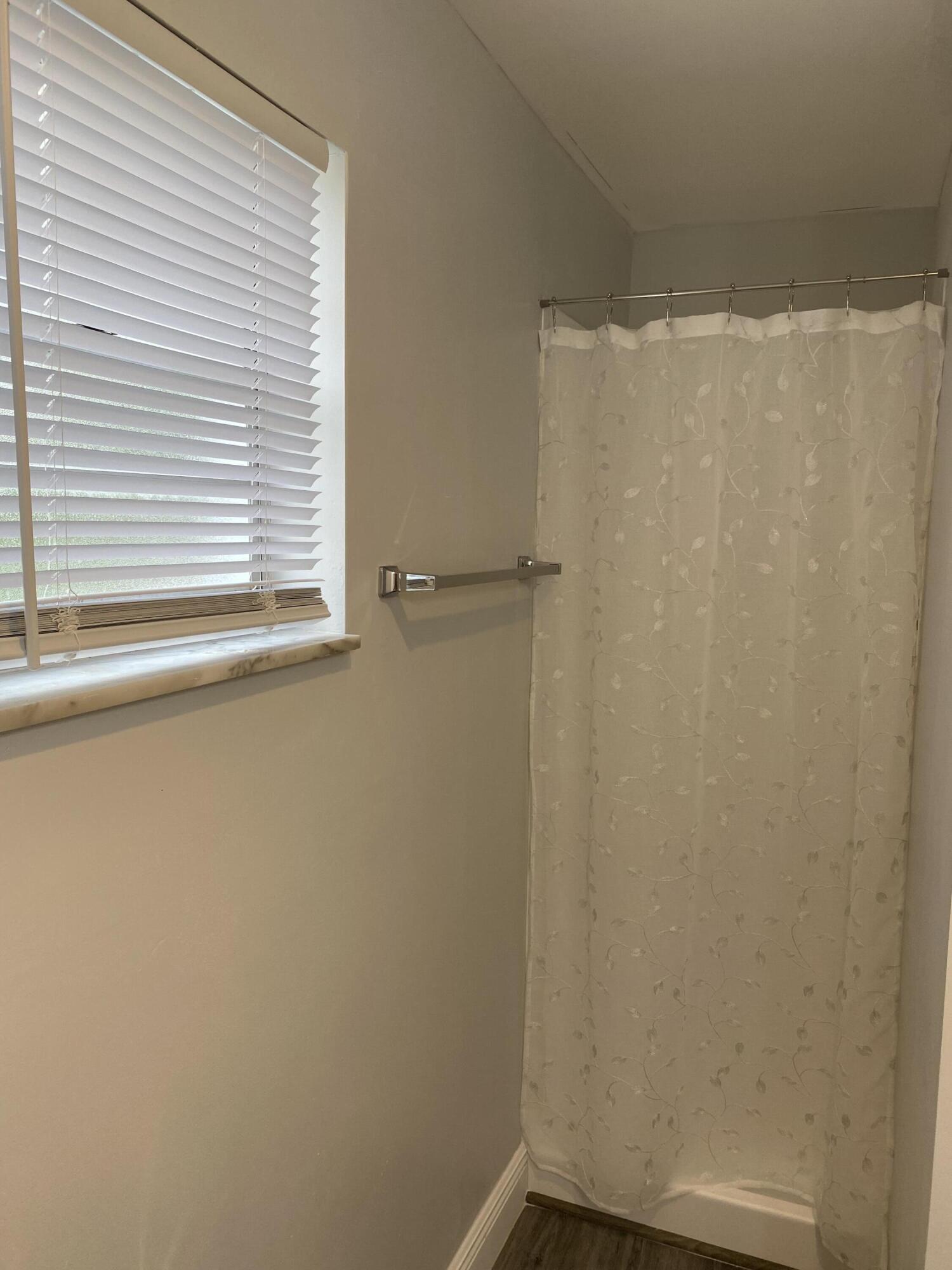 103 Southeast Norfolk Boulevard Stuart, FL 34997 - Photo 26 of 34 a view of a small space with a window