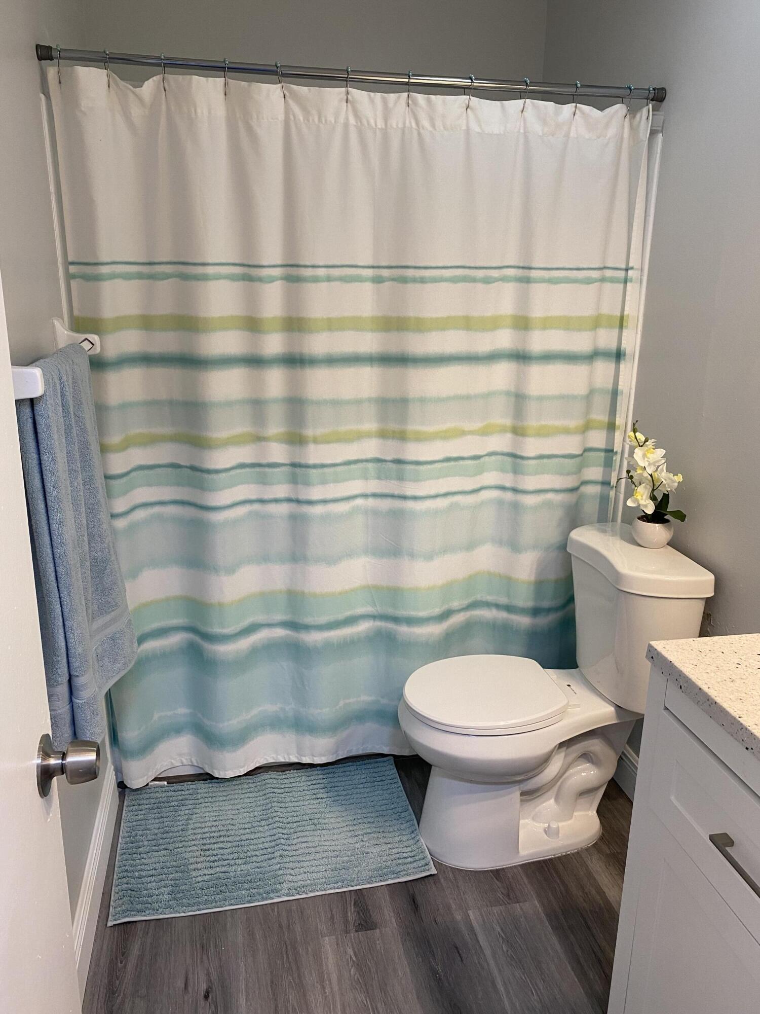 103 Southeast Norfolk Boulevard Stuart, FL 34997 - Photo 31 of 34 a bathroom with a sink and a toilet