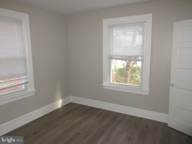 407 West Waverly Road Glenside, PA 19038 - Photo 11 of 23 an empty room with wooden floor and windows