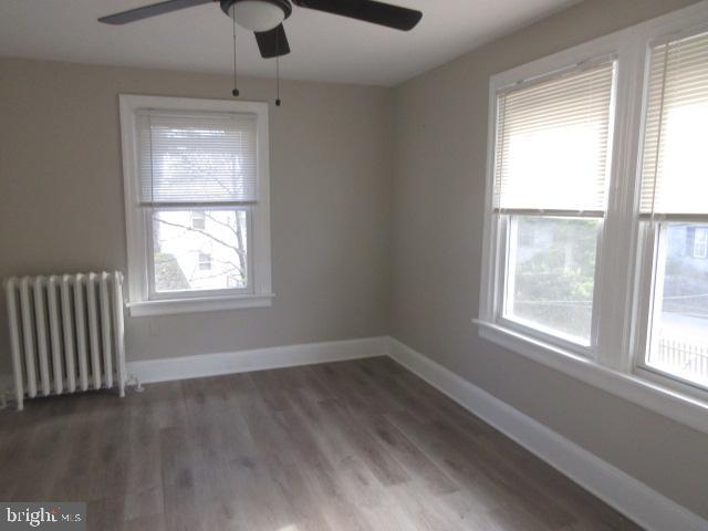 407 West Waverly Road Glenside, PA 19038 - Photo 13 of 23 a view of an empty room with wooden floor and a window