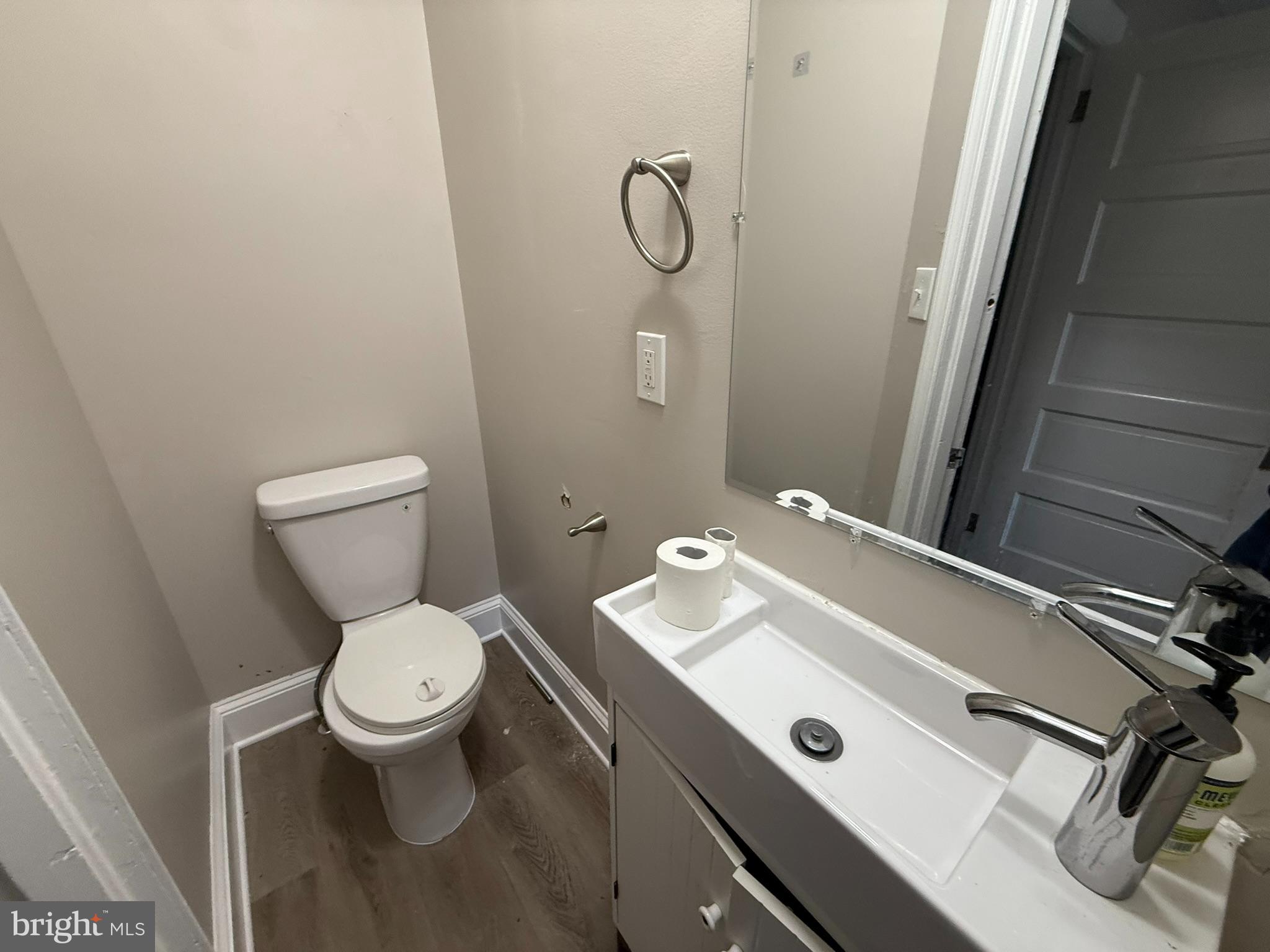 407 West Waverly Road Glenside, PA 19038 - Photo 9 of 23 a bathroom with a granite countertop toilet sink and mirror