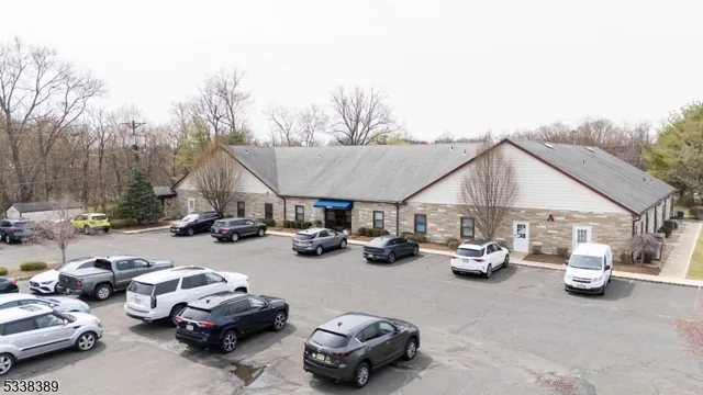a view of a cars park in front of house