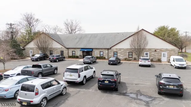 a view of cars parked in front of a house