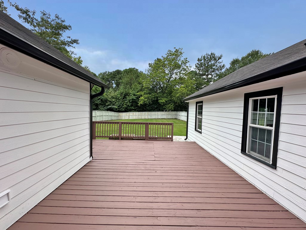 558 Macedonia Road Newnan, GA 30263 - Photo 8 of 44 a view of a wooden deck besides a house