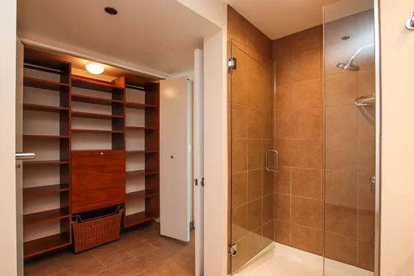 a view of closet area with empty racks