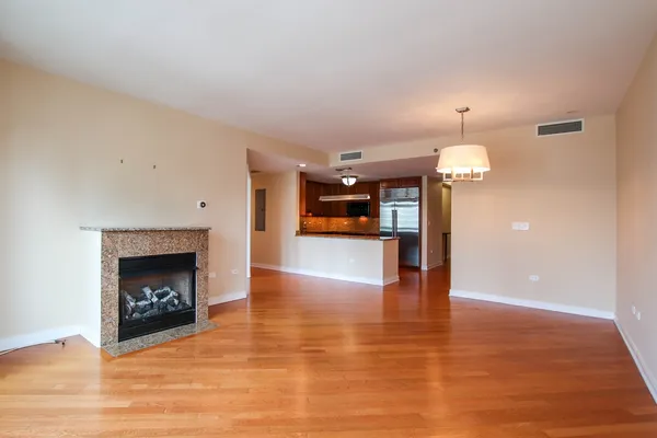 a view of an empty room and fire place