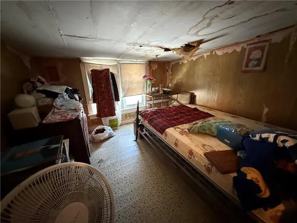 a bed room with a bed and a couch