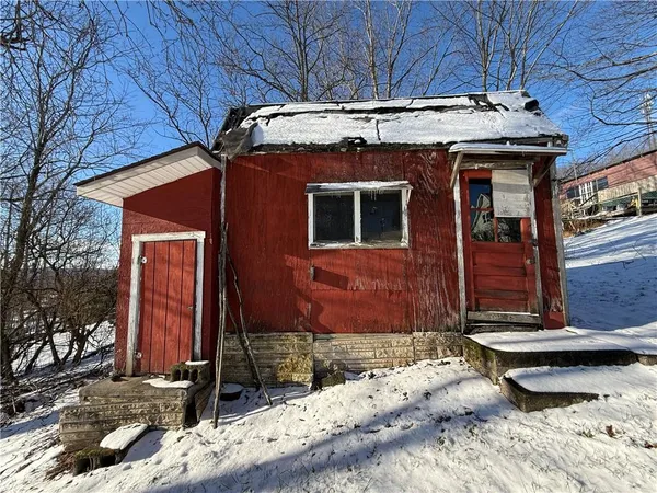 a view of a yard covered with snow