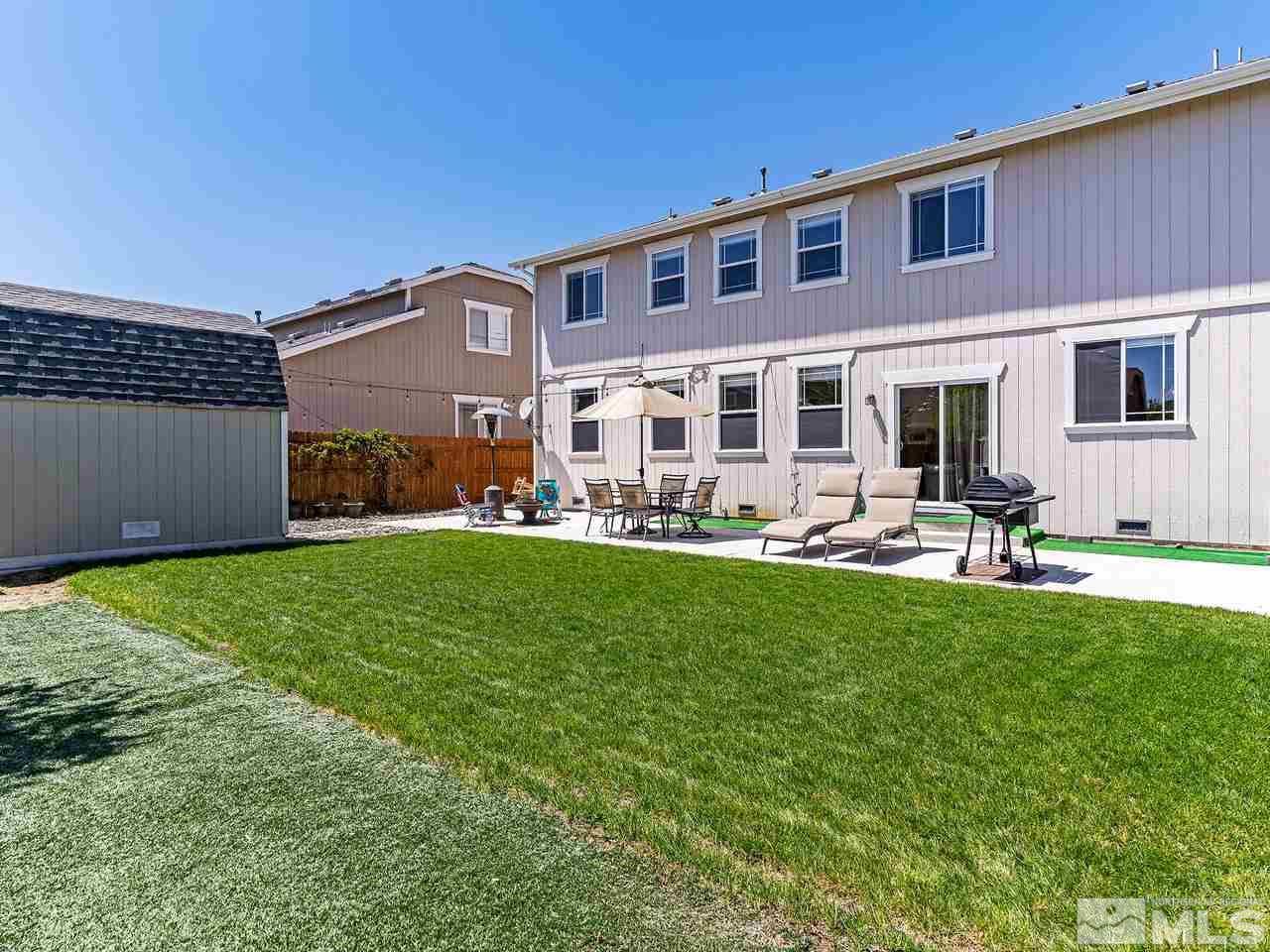8976 Wynne Street Reno, NV 89506 - Photo 14 of 24 a front view of a house with garden