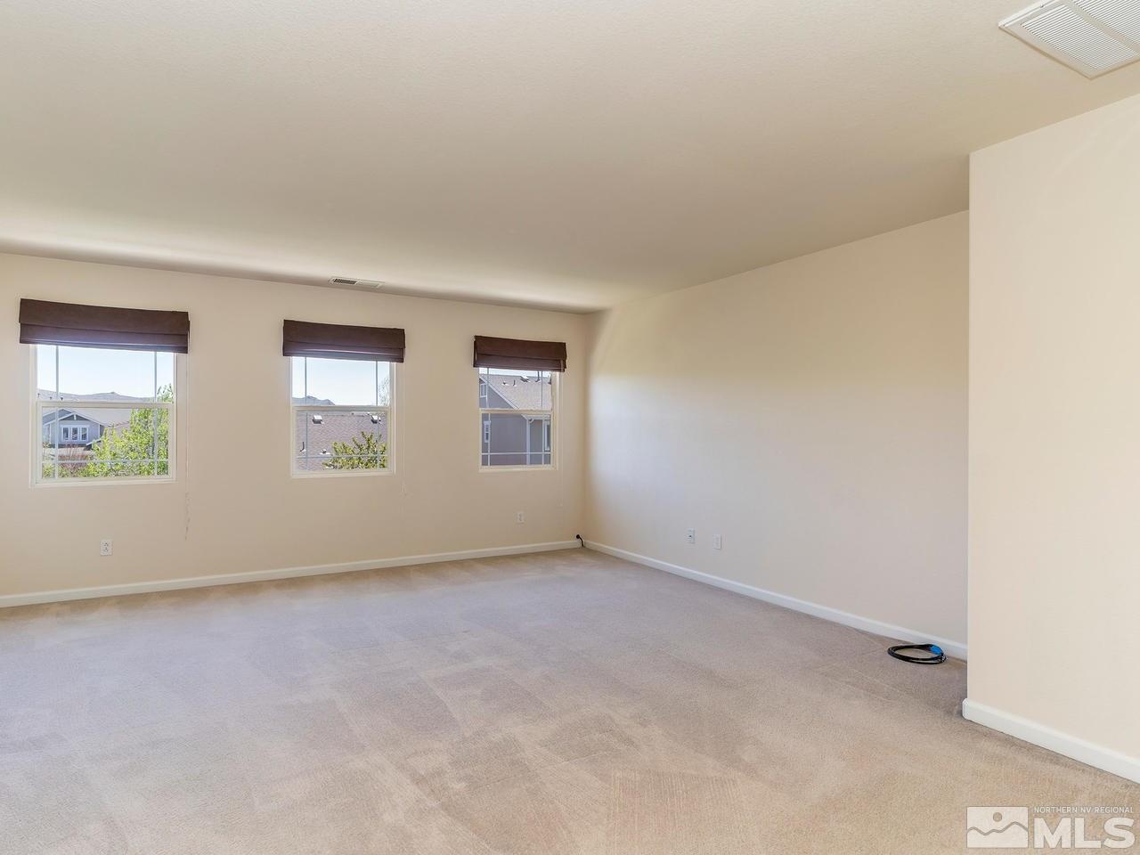 8976 Wynne Street Reno, NV 89506 - Photo 17 of 24 an empty room with windows