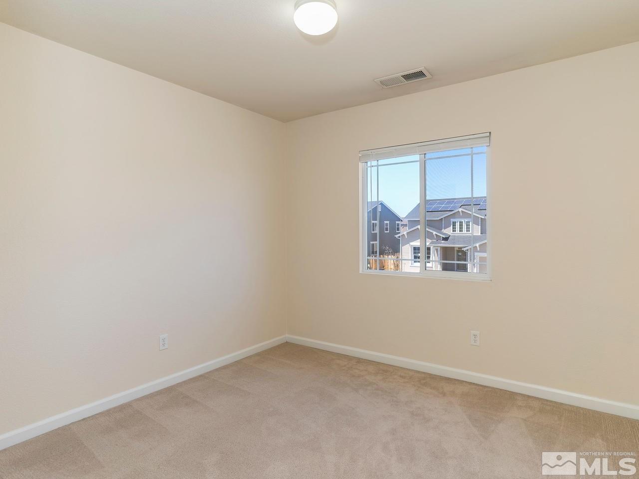 8976 Wynne Street Reno, NV 89506 - Photo 22 of 24 a view of an empty room with a window