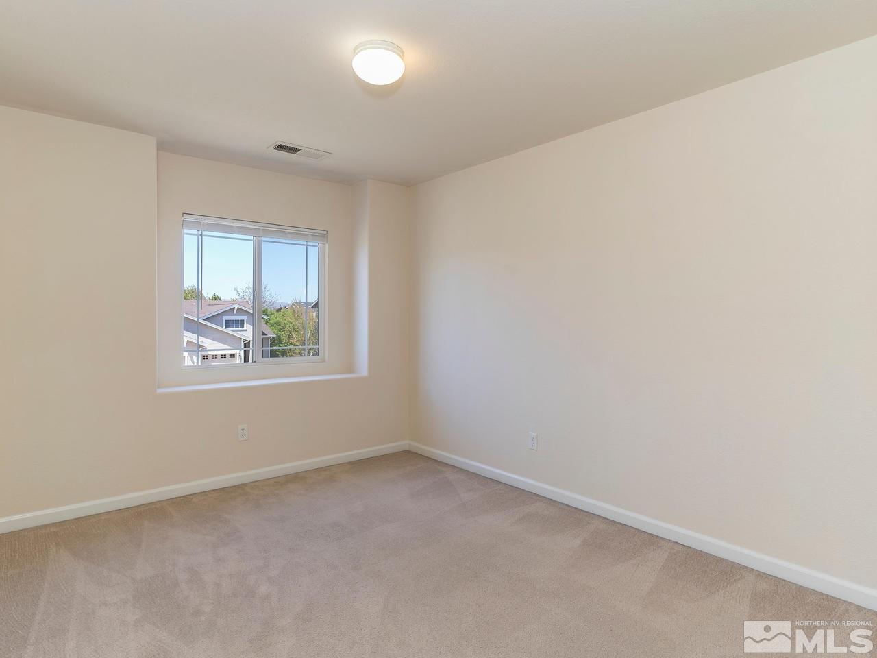 8976 Wynne Street Reno, NV 89506 - Photo 23 of 24 an empty room with windows