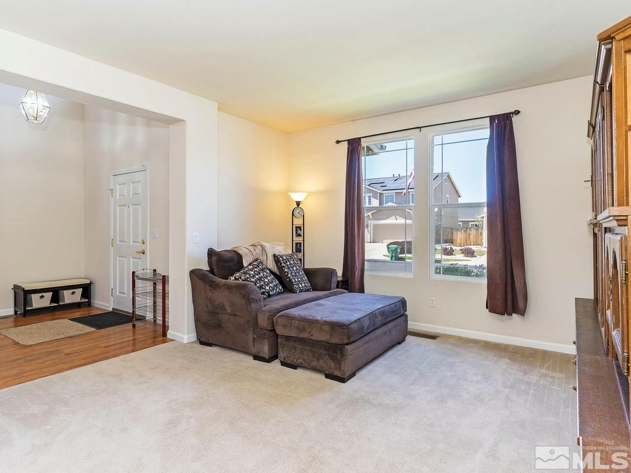 8976 Wynne Street Reno, NV 89506 - Photo 3 of 24 a living room with bed furniture and large window