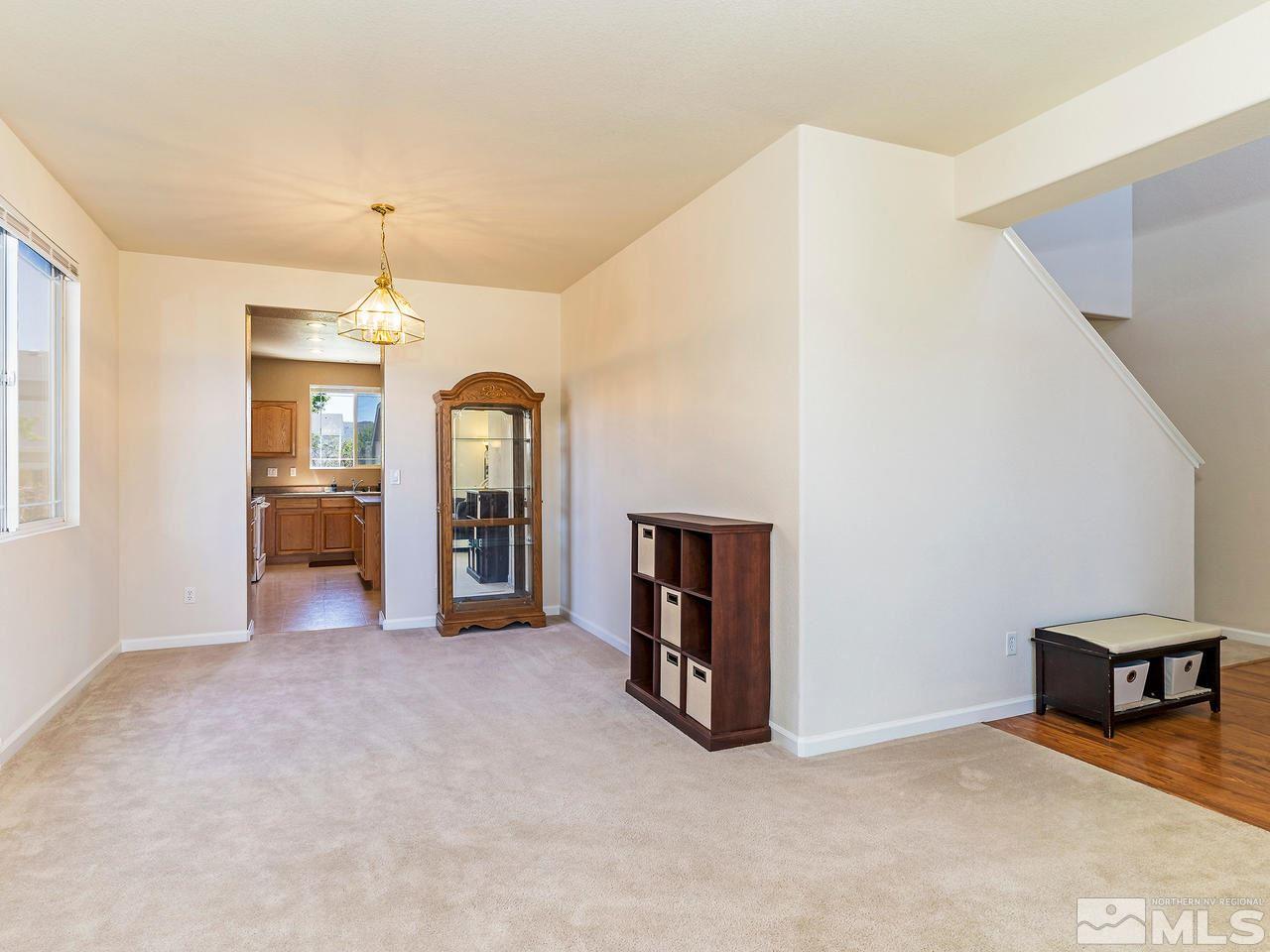 8976 Wynne Street Reno, NV 89506 - Photo 4 of 24 a view of a livingroom with furniture and window