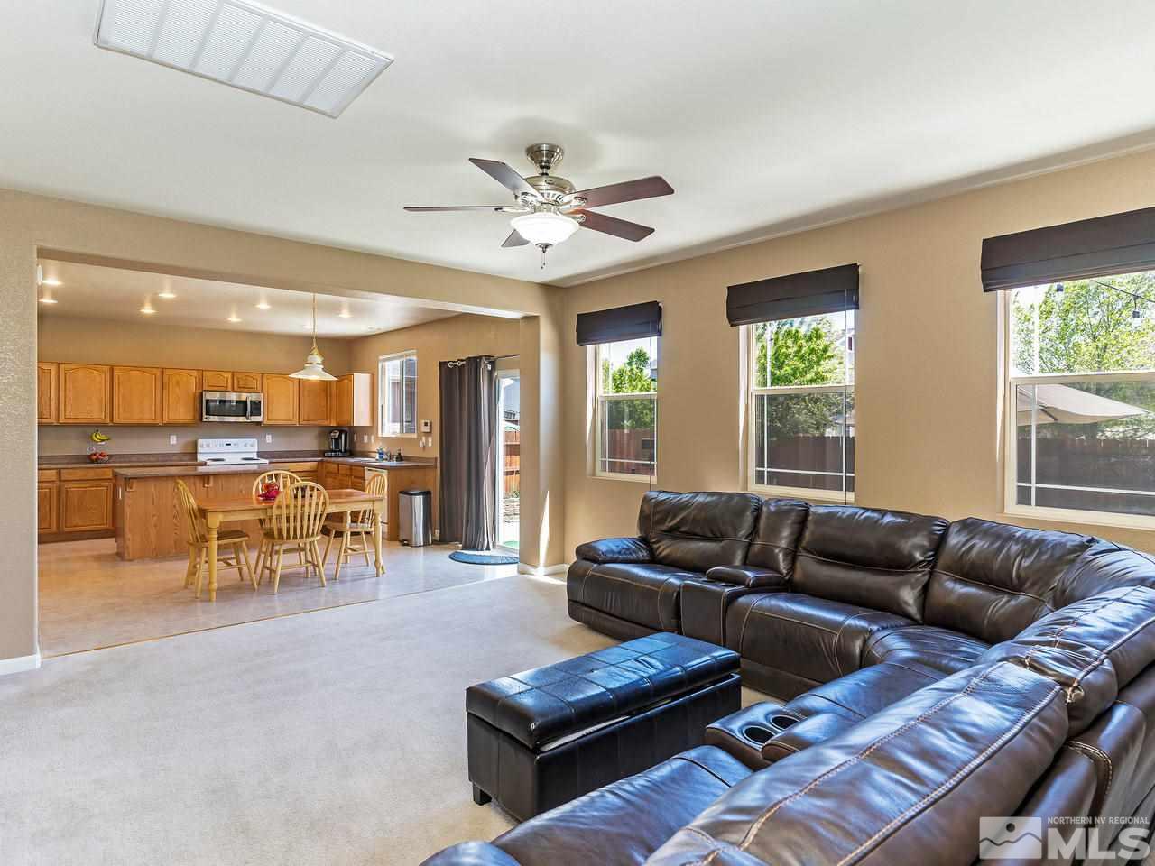 8976 Wynne Street Reno, NV 89506 - Photo 6 of 24 a living room with furniture and a large window