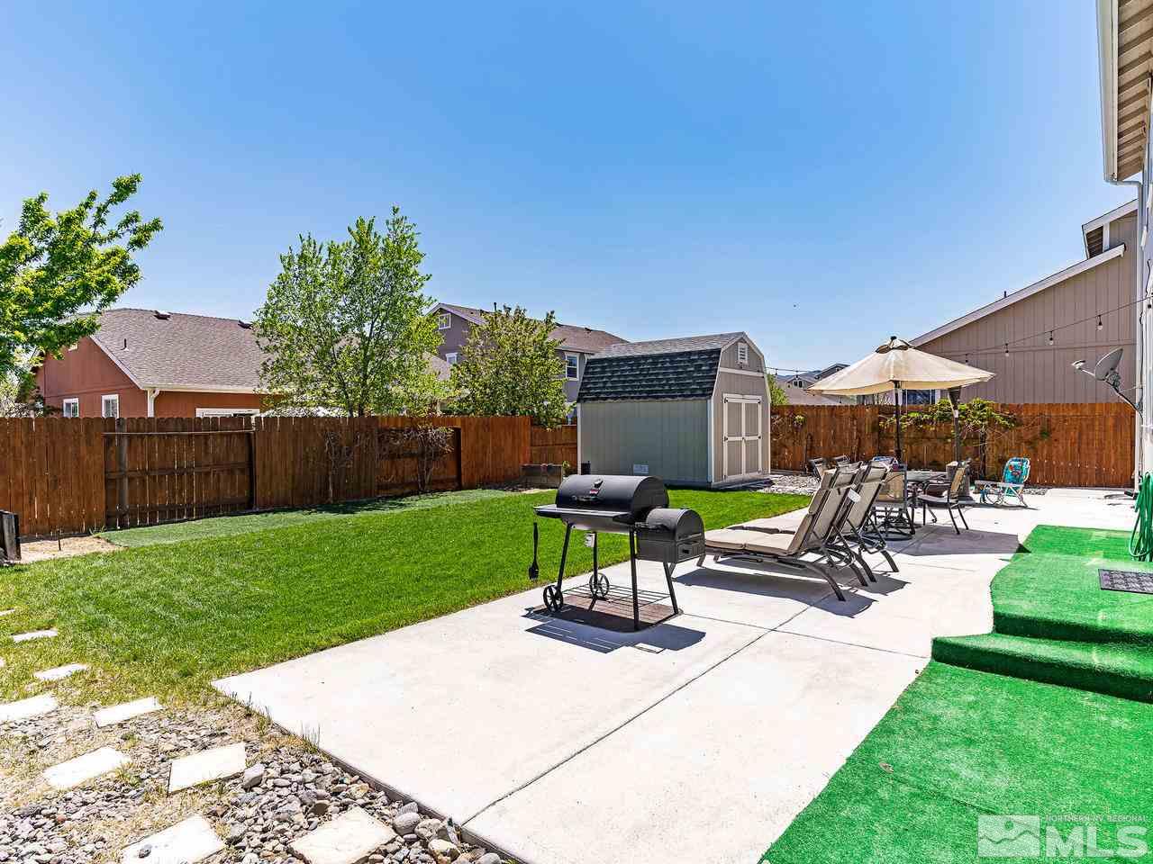 8976 Wynne Street Reno, NV 89506 - Photo 9 of 24 a view of a backyard with sitting area