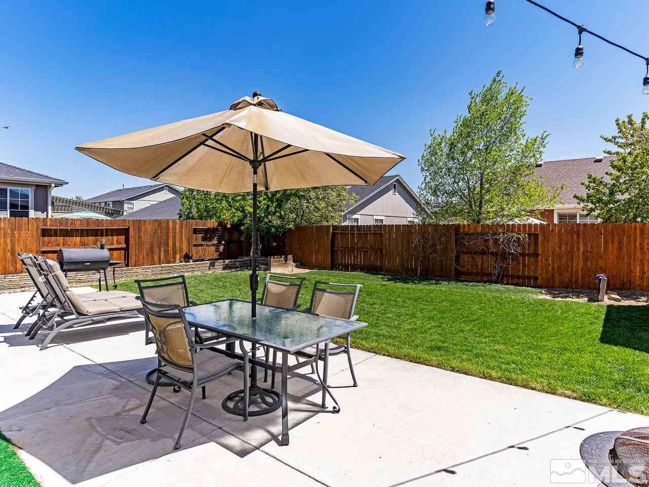 8976 Wynne Street Reno, NV 89506 - Photo 10 of 24 a view of a chair and table in the backyard