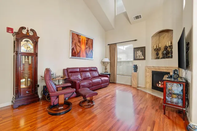 a living room with furniture and fireplace