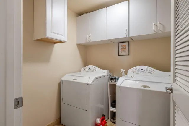 a utility room with dryer and washer