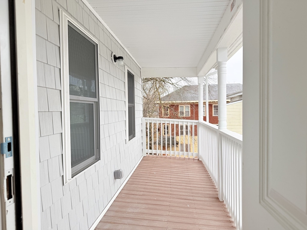 23 Bellevue Street, Unit 1 Worcester, MA 01609 - Photo 22 of 22 a view of a balcony with wooden floor