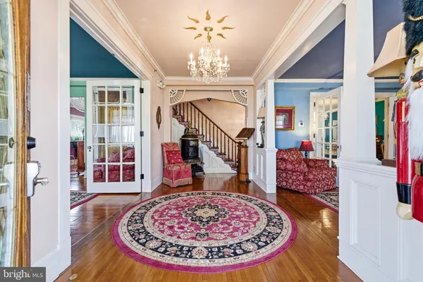 a living room with lots of furniture and a rug