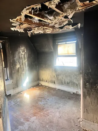 an empty room with a fireplace