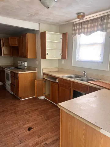 a kitchen with stainless steel appliances and sink