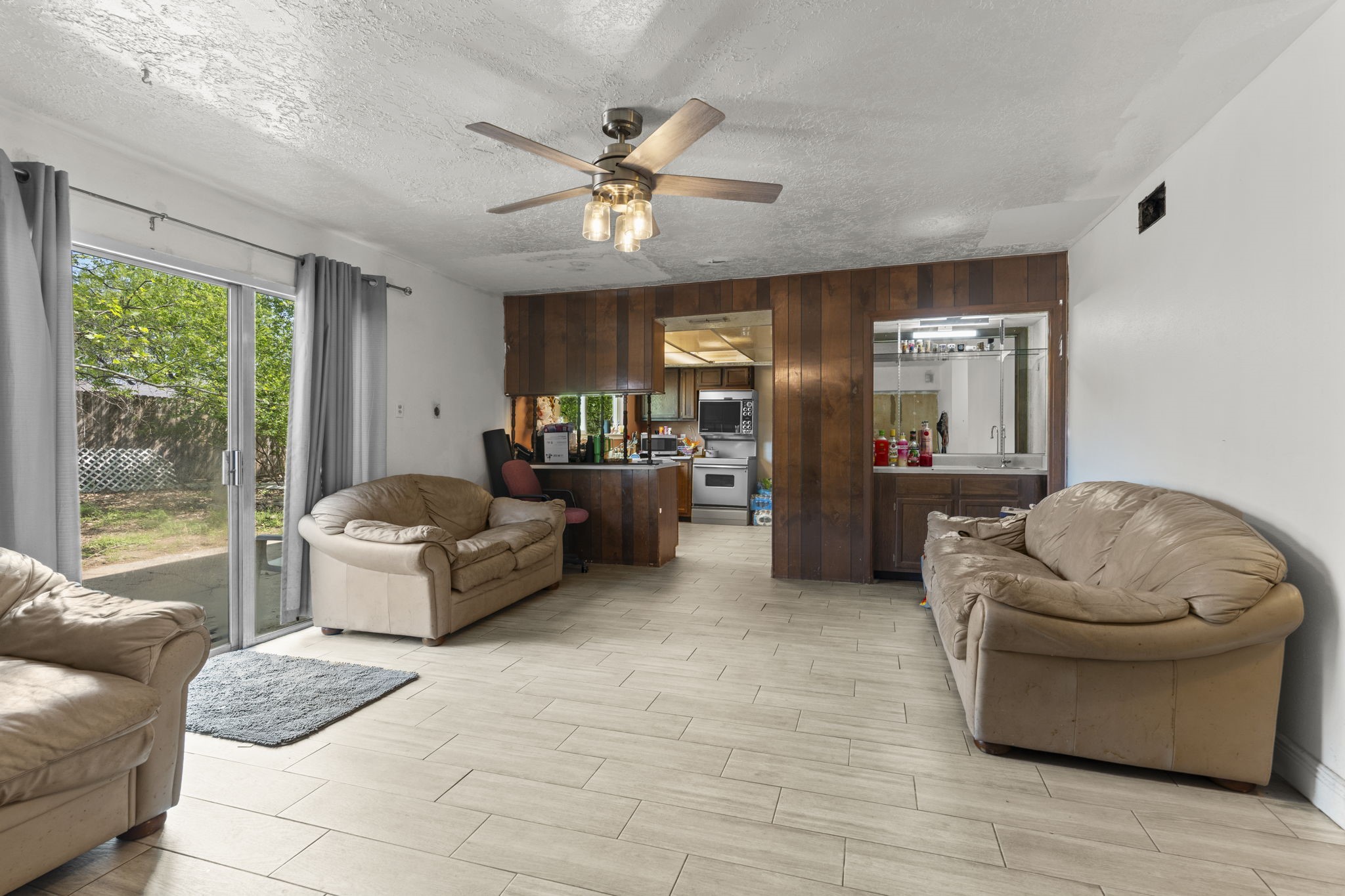 8506 Rivercross Road Houston, TX 77064 - Photo 16 of 32 a living room with furniture and a large window