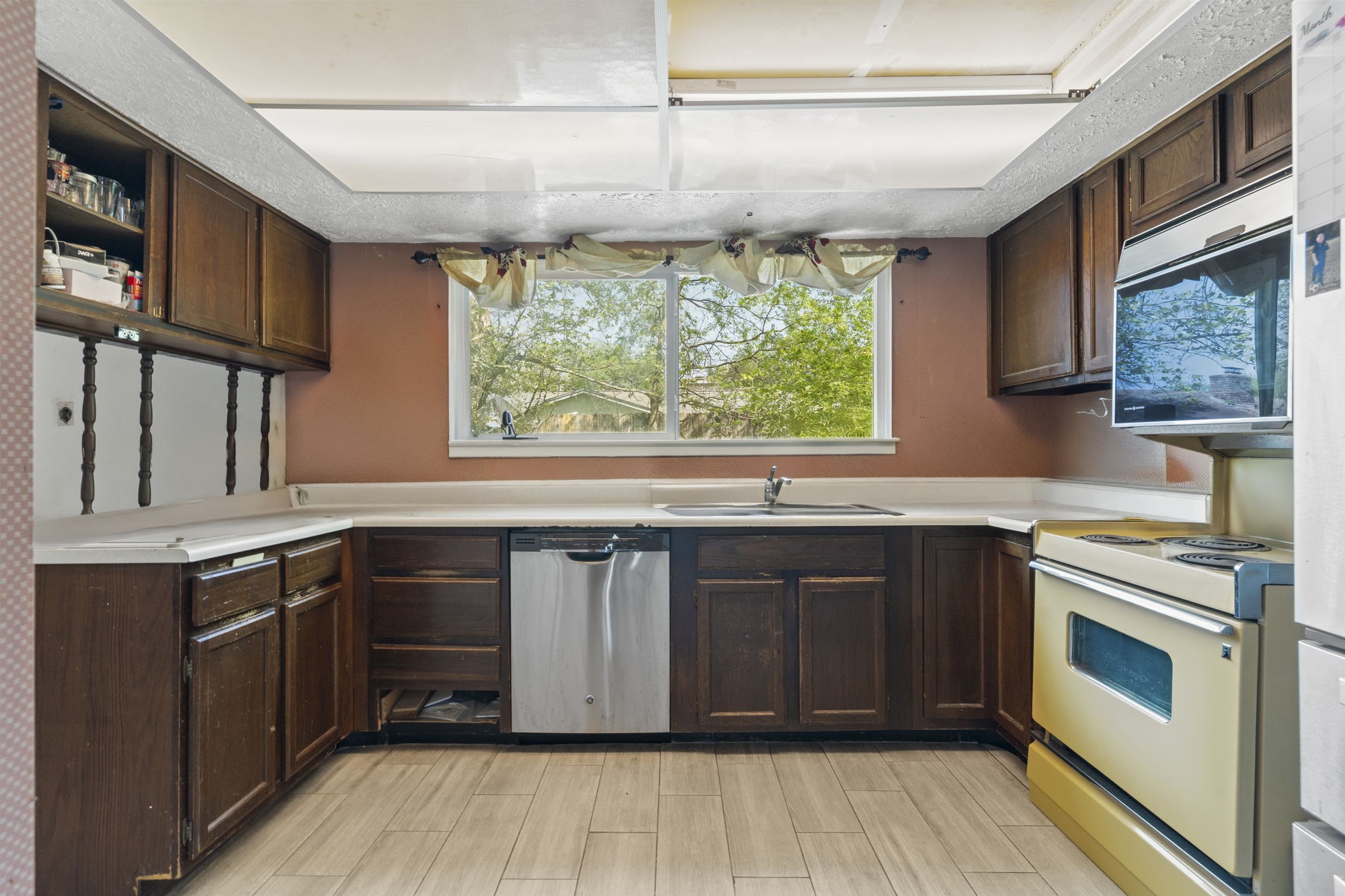 8506 Rivercross Road Houston, TX 77064 - Photo 18 of 32 a kitchen with a sink stove and cabinets