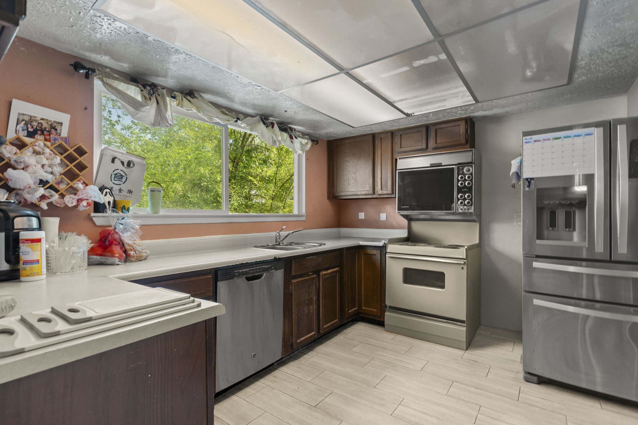 8506 Rivercross Road Houston, TX 77064 - Photo 19 of 32 a kitchen with a sink stove and microwave