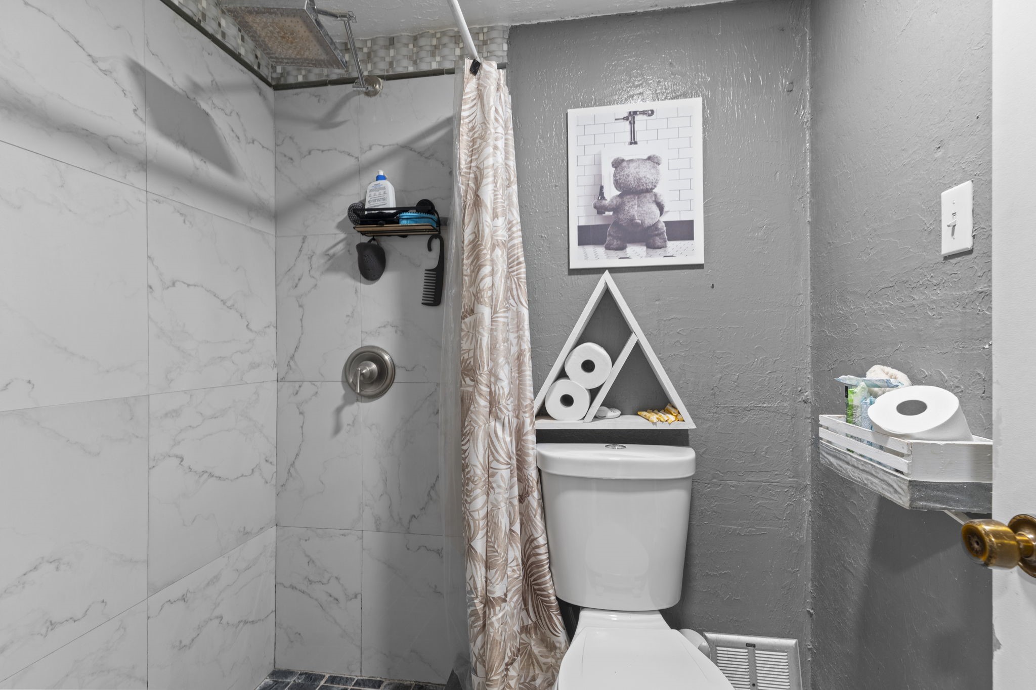 8506 Rivercross Road Houston, TX 77064 - Photo 23 of 32 a bathroom with a toilet and a shower curtain