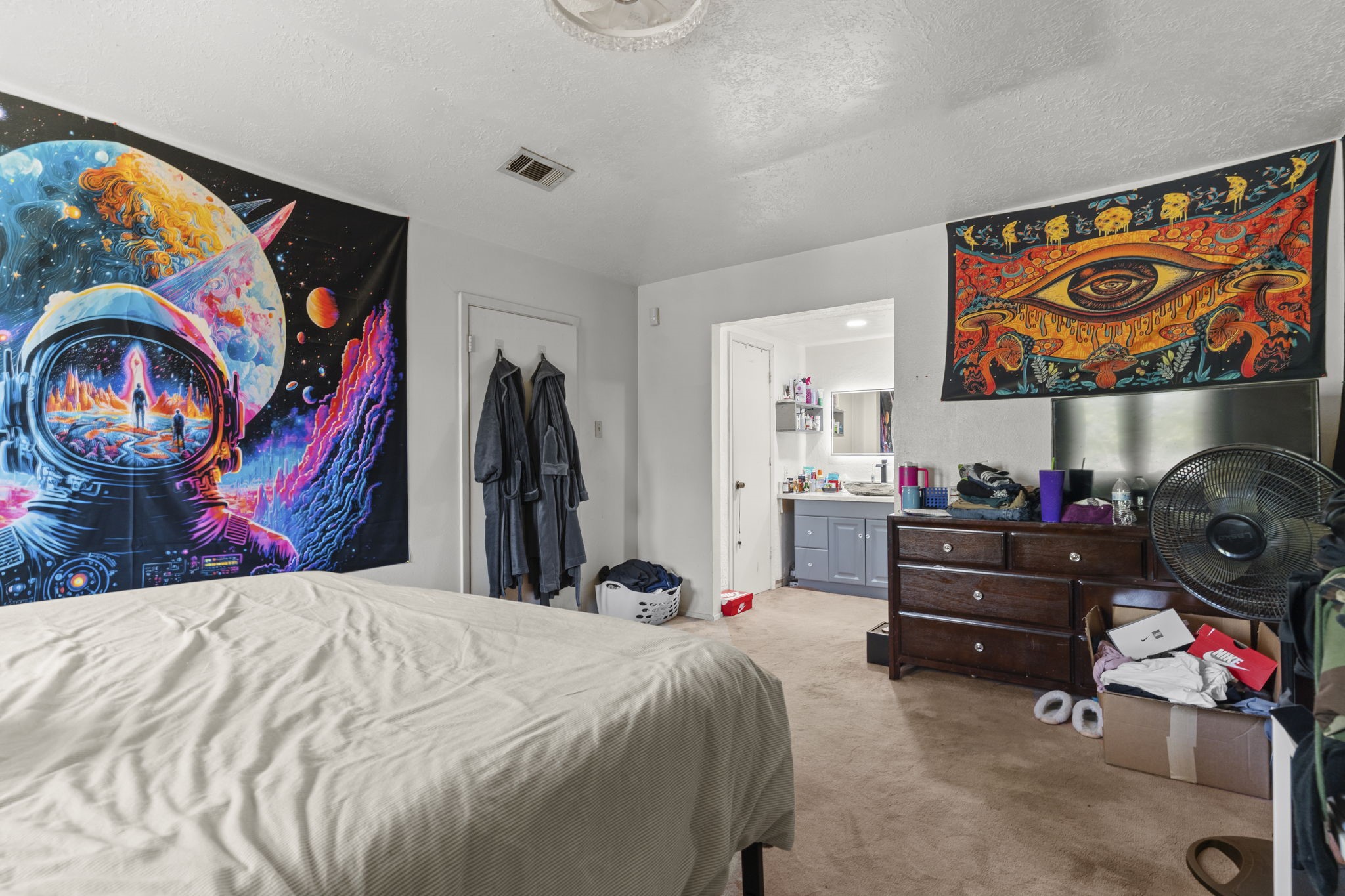8506 Rivercross Road Houston, TX 77064 - Photo 24 of 32 a bed room with a bed and a painting on the wall