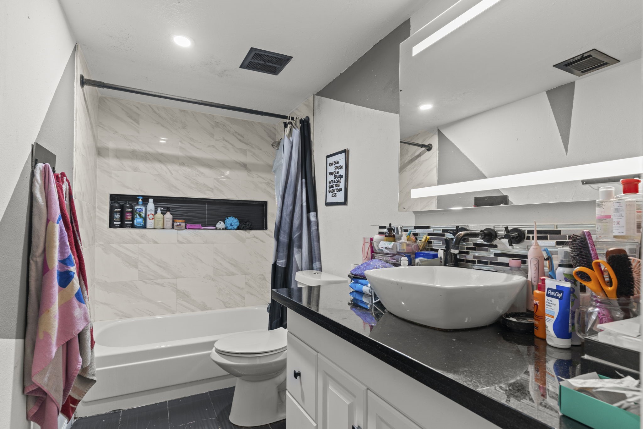 8506 Rivercross Road Houston, TX 77064 - Photo 26 of 32 a bathroom with a sink and a mirror