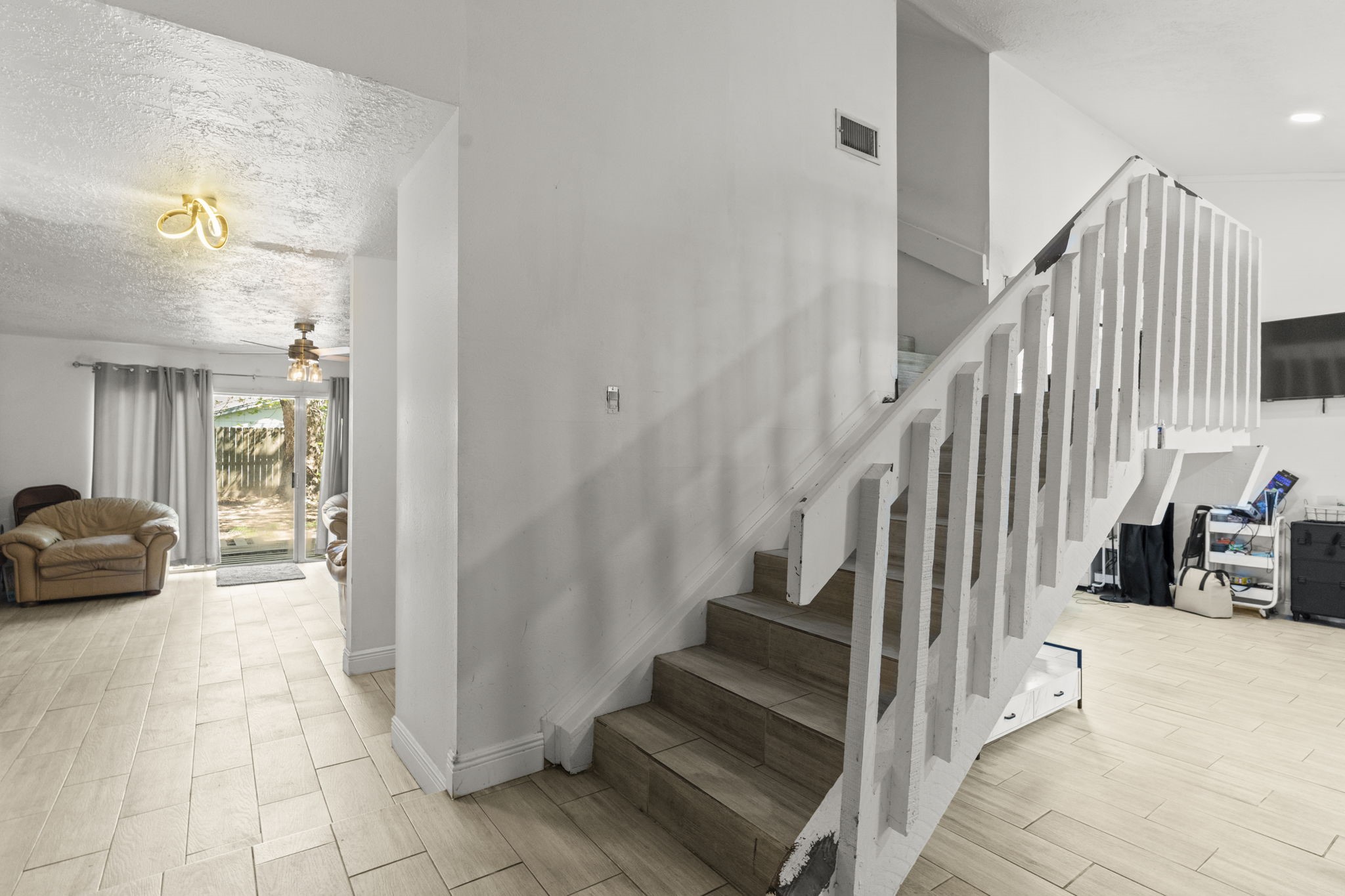 8506 Rivercross Road Houston, TX 77064 - Photo 6 of 32 a view of entryway and hall with wooden floor