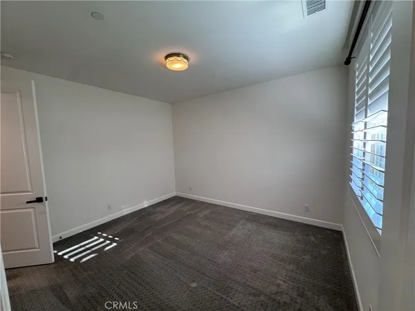 a spacious bathroom with a double vanity sink and a mirror