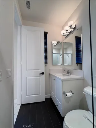 a bathroom with a shower and toilet
