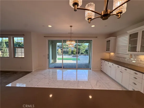 a kitchen with stainless steel appliances granite countertop a sink a stove and a granite counter tops