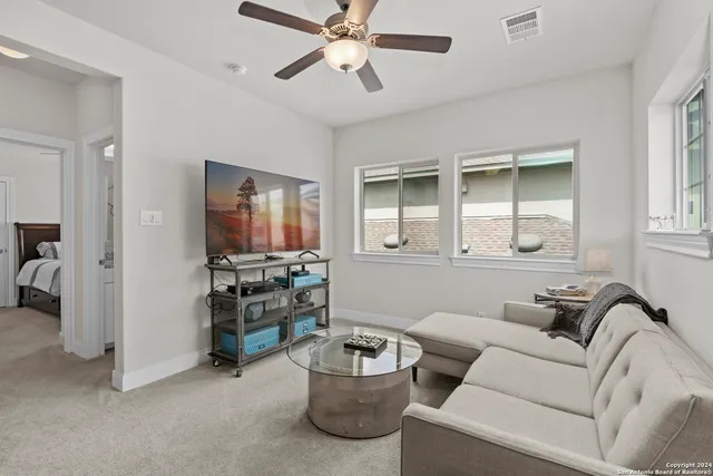 a living room with furniture and a window