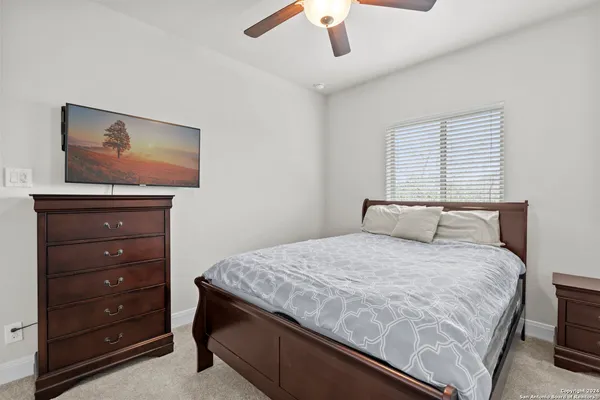 a bedroom with a bed and a dresser