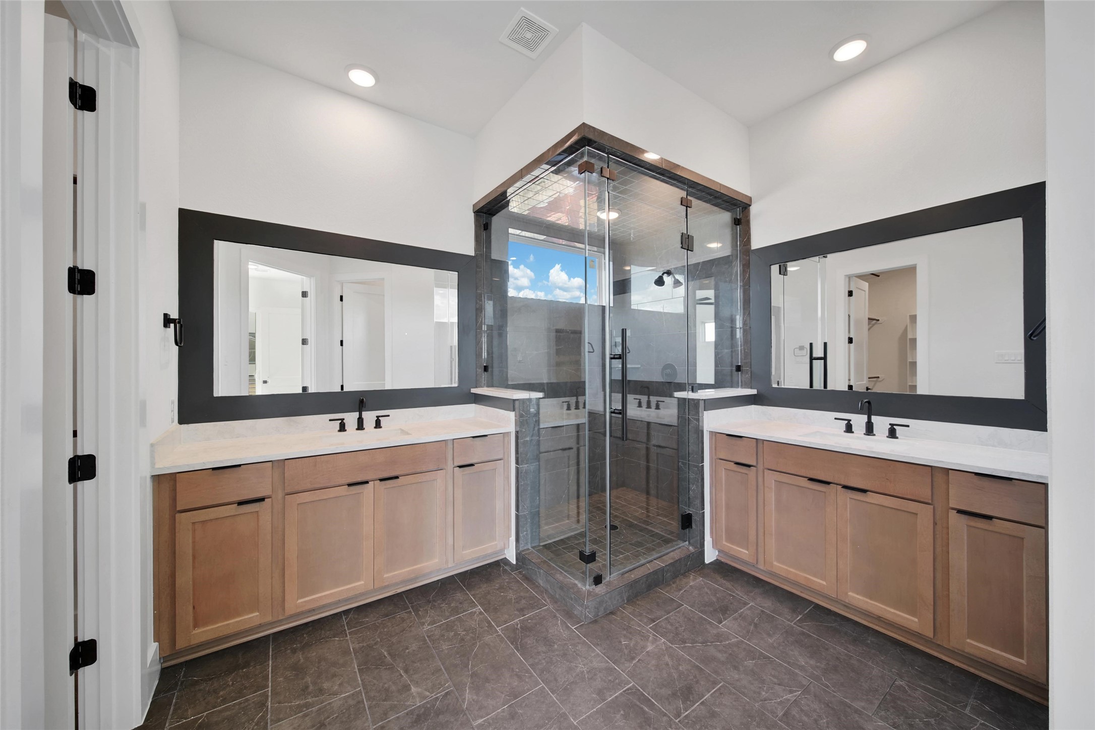 4404 Anthony Court Lane Seabrook, TX 77586 - Photo 12 of 36 a spacious bathroom with a double vanity sink mirror and bathtub