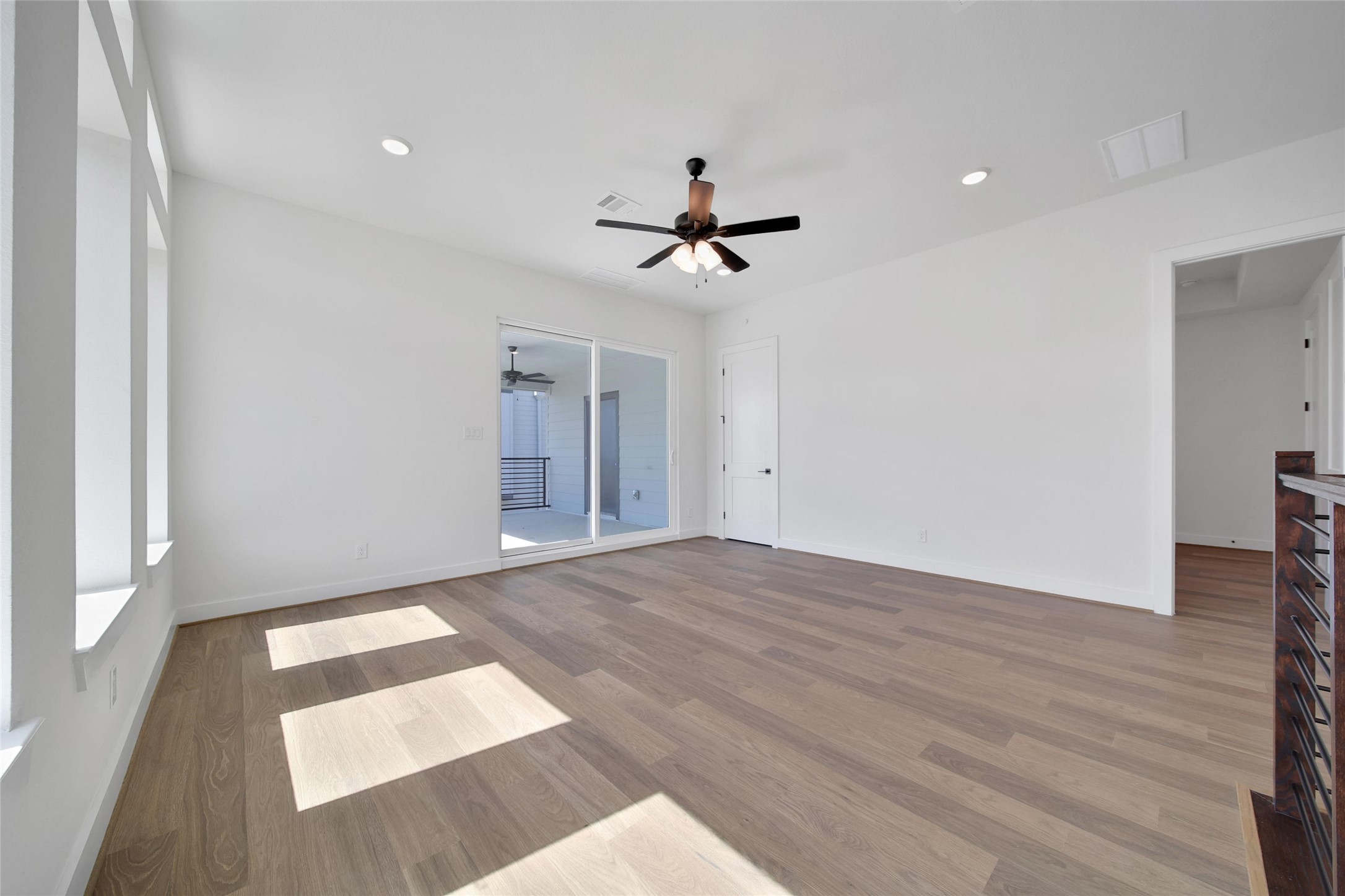 4404 Anthony Court Lane Seabrook, TX 77586 - Photo 14 of 36 wooden floor in an empty room with a window